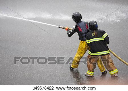 Men dressed in yellow firemen slickers and firehoses have annual Waterfight on July 4, Ouray, CO View Large Photo Image Stock Image - Men dressed in yellow firemen slickers and firehoses have annual Waterfight on July 4, Ouray, CO. Fotosearch