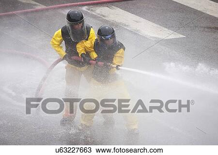 Men dressed in yellow firemen slickers and firehoses have annual Waterfight on July 4, Ouray, CO View Large Photo Image Stock Image - Men dressed in yellow firemen slickers and firehoses have annual Waterfight on July 4, Ouray, CO. Fotosearch