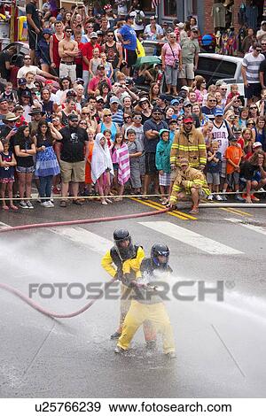 Men dressed in yellow firemen slickers and firehoses have annual Waterfight on July 4, Ouray, CO View Large Photo Image Stock Photo - Men dressed in yellow firemen slickers and firehoses have annual Waterfight on July 4, Ouray, CO. Fotosearch
