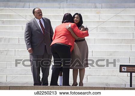 Reverend Bernice King hugs MLK III and wife at the National Action to Realize the Dream march and rally commemorating the 50th Anniversary of the march on Washington, D. C. View Large Photo Image Stock Image - Reverend Bernice King hugs MLK III and wife at the National Action to Realize the Dream march and rally commemorating the 50th Anniversary of the march on Washington, D. C.. Fotosearch