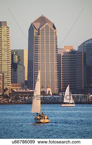 Stock Photo - Scenic San Diego skyline and waterfront, Pacific Ocean at dusk with lights on, California. Fotosearch