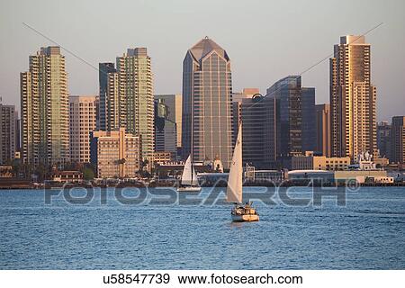 Scenic San Diego skyline, sailboat and waterfront, Pacific Ocean at sunset, California View Large Photo Image Stock Photo - Scenic San Diego skyline, sailboat and waterfront, Pacific Ocean at sunset, California. Fotosearch