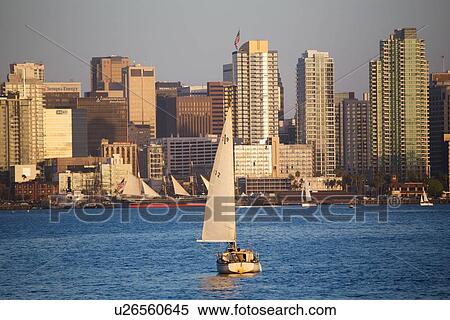 Stock Photography - Scenic San Diego skyline, sailboat and waterfront, Pacific Ocean at sunset, California. Fotosearch