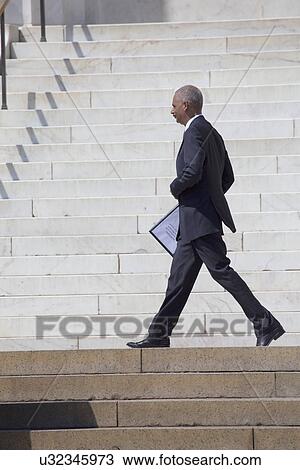 U. S. Attorney Eric Holder Jr. departs at National Action to Realize the Dream march and rally commemorating the 50th Anniversary of the march on Washington, D. C. View Large Photo Image Stock Image - U. S. Attorney Eric Holder Jr. departs at National Action to Realize the Dream march and rally commemorating the 50th Anniversary of the march on Washington, D. C.. Fotosearch