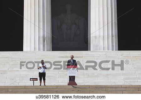 Stock Photograph - U. S. Attorney Eric Holder Jr. speaks at the National Action to Realize the Dream march and rally commemorating the 50th Anniversary of the march on Washington, D. C.. Fotosearch