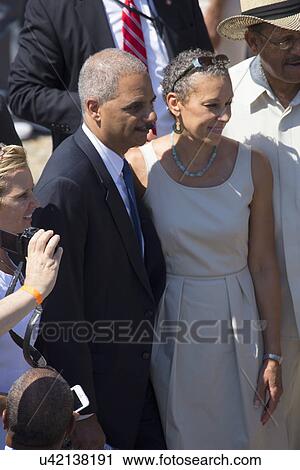 Stock Image - US Attorney General Eric Holder and wife at the National Action to Realize the Dream march and rally commemorating the 50th Anniversary of the march on Washington, D. C.. Fotosearch