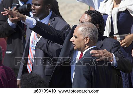 Stock Image - US Attorney General Eric Holder at the National Action to Realize the Dream march and rally commemorating the 50th Anniversary of the march on Washington, D. C.. Fotosearch