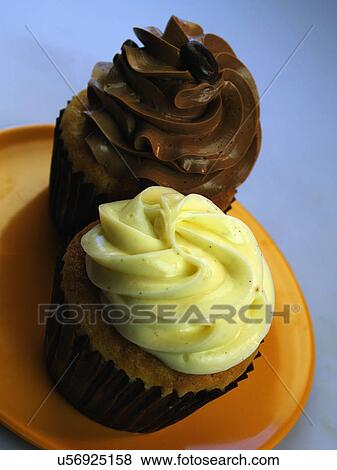 Stock Photo - Banana And Chocolate Cupcakes On Plate In Studio. Fotosearch
