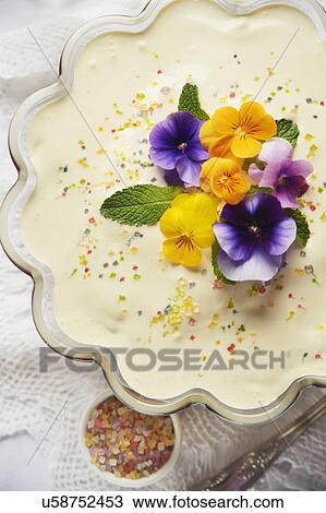Stock Image - Bowl Of Homemade Sherry Trifle With Flowers. Fotosearch