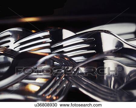 Stock Image - Close Up Of Metal Forks Arranged Randomly. Fotosearch