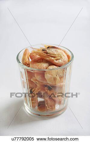 Glass Of Shell On Prawns Against White Background View Large Photo Image Stock Photography - Glass Of Shell On Prawns Against White Background. Fotosearch