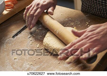 Stock Photo - Man Making Cheese Scones. Fotosearch