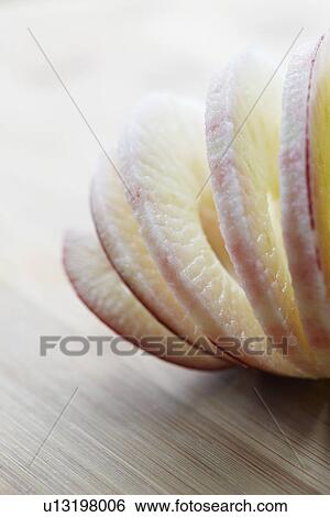 Peeled And Sliced Red Devil Apple On Wood View Large Photo Image Stock Photograph - Peeled And Sliced Red Devil Apple On Wood. Fotosearch