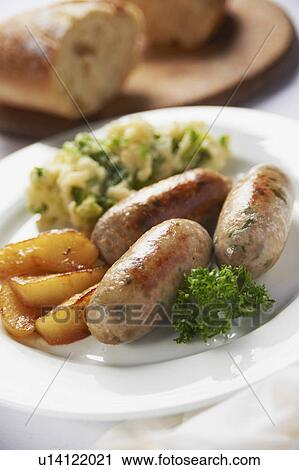 Stock Image - Plate Of Pork And Leek Sausages With Bubble And Squeak. Fotosearch