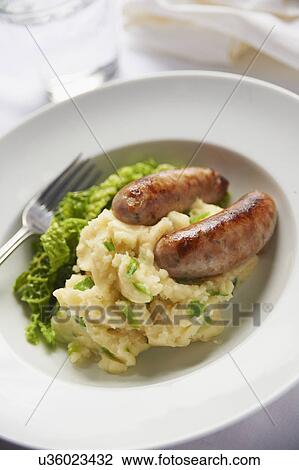 Stock Image - Plate Of Pork Sausages With Mashed Potato And Champ. Fotosearch