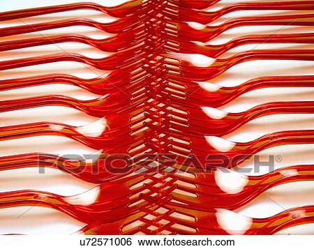 Stock Photograph - Red Plastic Forks Arranged Touching Ends. Fotosearch