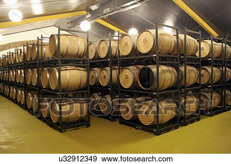 Stock Photo - Red Wine Maturing In Oak Barrels. Fotosearch