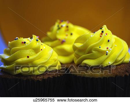 Trio Of Yellow Iced Cupcakes In A Row View Large Photo Image Stock Photography - Trio Of Yellow Iced Cupcakes In A Row. Fotosearch