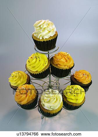Various Colourful Iced Cupcakes On A Cake Stand View Large Photo Image Stock Photograph - Various Colourful Iced Cupcakes On A Cake Stand. Fotosearch