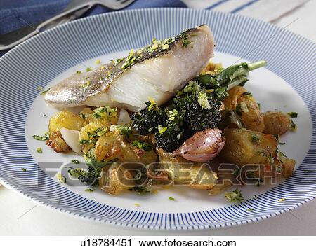 A baked fillet of pollock on a bed of crispy crushed Charlotte potatoes with purple sprouting broccoli sage and garlic and gremolata sauce View Large Photo Image Stock Image - A baked fillet of pollock on a bed of crispy crushed Charlotte potatoes with purple sprouting broccoli sage and garlic and gremolata sauce. Fotosearch