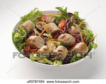 A bowl of bratwurst with salad on a neutral background View Large Photo Image Picture - A bowl of bratwurst with salad on a neutral background. Fotosearch