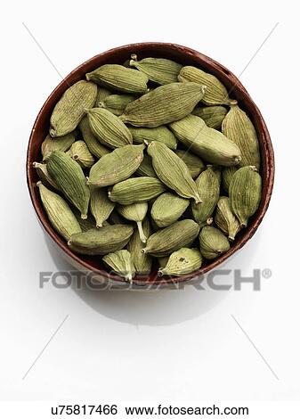 A bowl of green cardamoms on a white background View Large Photo Image Stock Photograph - A bowl of green cardamoms on a white background. Fotosearch