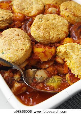 A casserole dish of roast vegetable stew with cobblers View Large Photo Image Stock Photograph - A casserole dish of roast vegetable stew with cobblers. Fotosearch