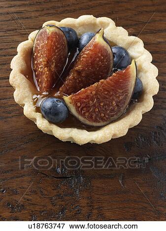 A fig tart on a wood surface View Large Photo Image Stock Photo - A fig tart on a wood surface. Fotosearch