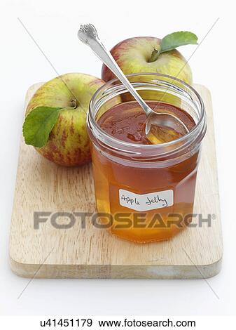 A glass jar of apple jelly with whole apples behind View Large Photo Image Stock Photo - A glass jar of apple jelly with whole apples behind. Fotosearch