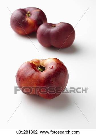 A pile of ripe peento nectarines on a white background View Large Photo Image Stock Image - A pile of ripe peento nectarines on a white background. Fotosearch