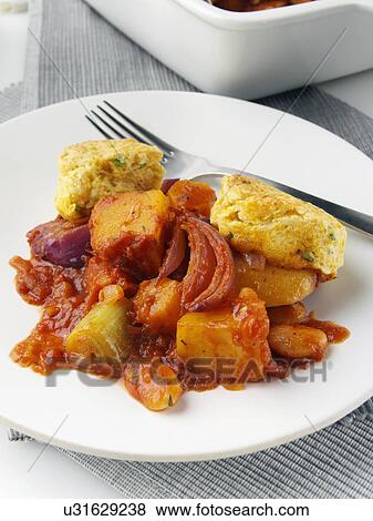 A plate of roast vegetable stew with cobblers View Large Photo Image Stock Photo - A plate of roast vegetable stew with cobblers. Fotosearch