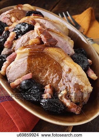 A platter of double pork chops with lardons and prunes View Large Photo Image Picture - A platter of double pork chops with lardons and prunes. Fotosearch