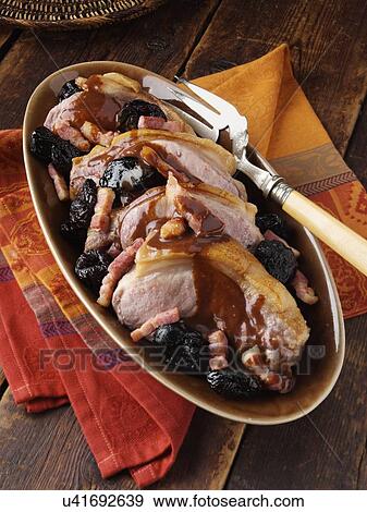 A platter of double pork chops with lardons and prunes View Large Photo Image Stock Photo - A platter of double pork chops with lardons and prunes. Fotosearch
