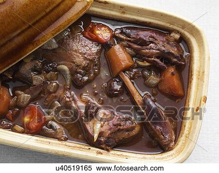 Stock Photography - A rustic pot of rabbit stew. Fotosearch