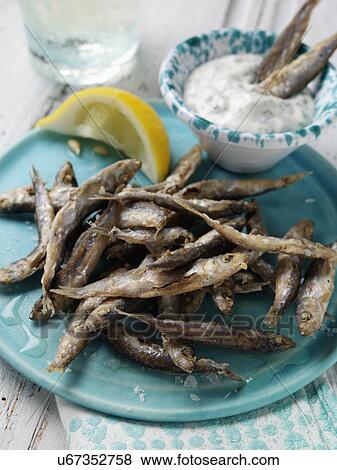 A single serving of deep fried whitebait with tartare sauce dip View Large Photo Image Stock Photo - A single serving of deep fried whitebait with tartare sauce dip. Fotosearch