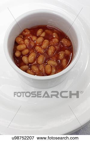 A white ramekin of baked beans View Large Photo Image Stock Photo - A white ramekin of baked beans. Fotosearch
