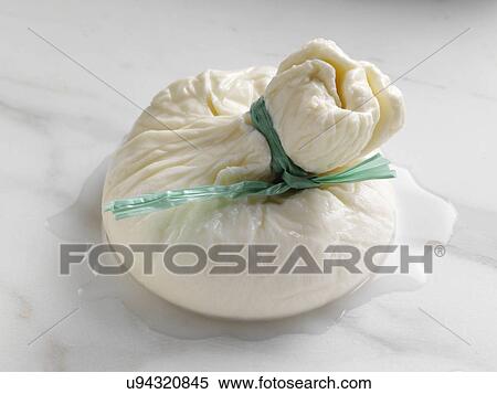 Stock Photography - A whole Burrito Italian soft cheese. Fotosearch