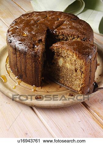A whole Somerset apple cake with a slice View Large Photo Image Stock Image - A whole Somerset apple cake with a slice. Fotosearch
