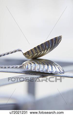 Stock Image - Abstract View Of Metal Butterfly Spoons. Fotosearch