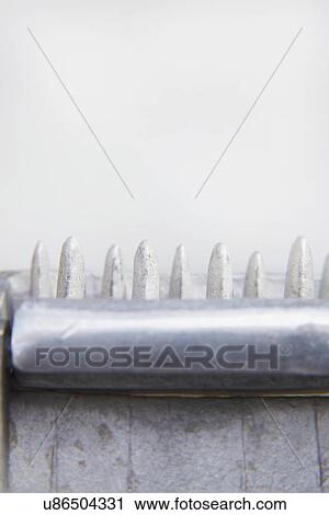 Stock Image - Abstract View Of Metal Ice Crusher. Fotosearch