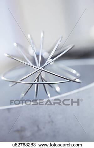 Stock Image - Abstract View Of Metal Whisk. Fotosearch