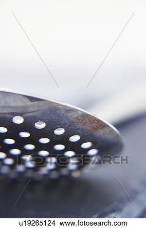 Picture - Abstract View Of Slotted Spoon. Fotosearch