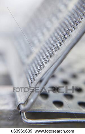 Stock Photo - Abstract View Of Triangular Metal Grater. Fotosearch