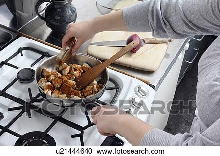 Adding spice to frying chicken View Large Photo Image Stock Image - Adding spice to frying chicken. Fotosearch