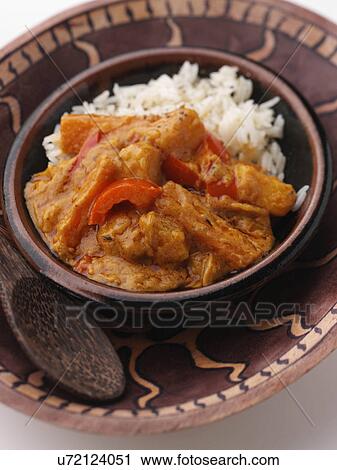 Stock Image - African peanut stew and rice vegetarian main meals. Fotosearch