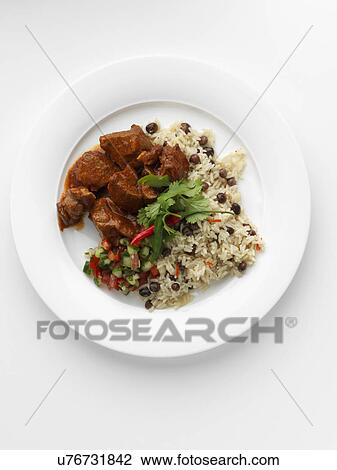 An individual portion of goat curry View Large Photo Image Stock Image - An individual portion of goat curry. Fotosearch