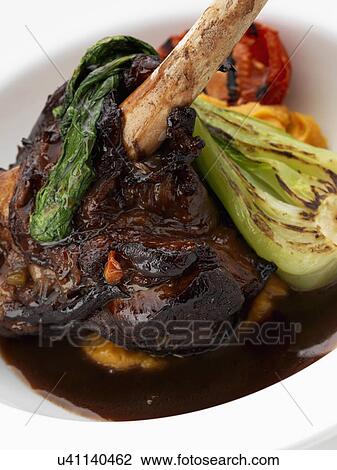 An individual portion of Lamb shank View Large Photo Image Stock Image - An individual portion of Lamb shank. Fotosearch
