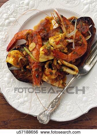 Stock Photograph - An individual portion of tiger prawns seafood. Fotosearch