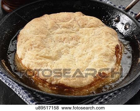 Stock Photo - Apple pie cooking in pan. Fotosearch