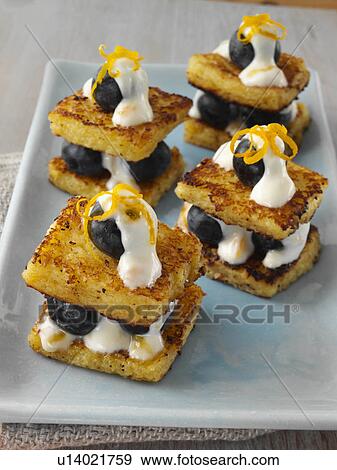 Stock Photo - Baby French toast with creamy blueberry stuffing. Fotosearch